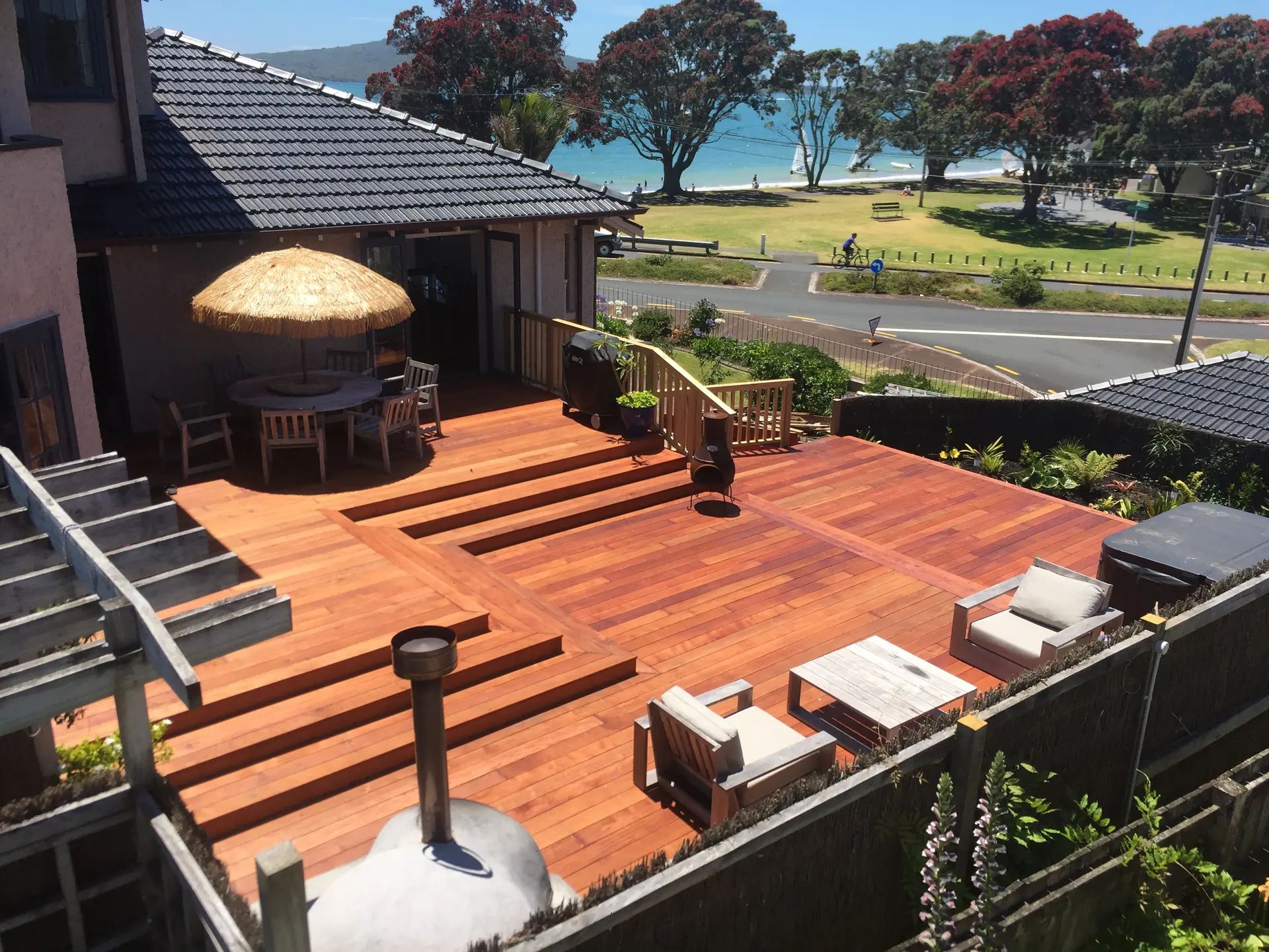 Deck with steps overlooking the beach, built by Custom Decks and Fences