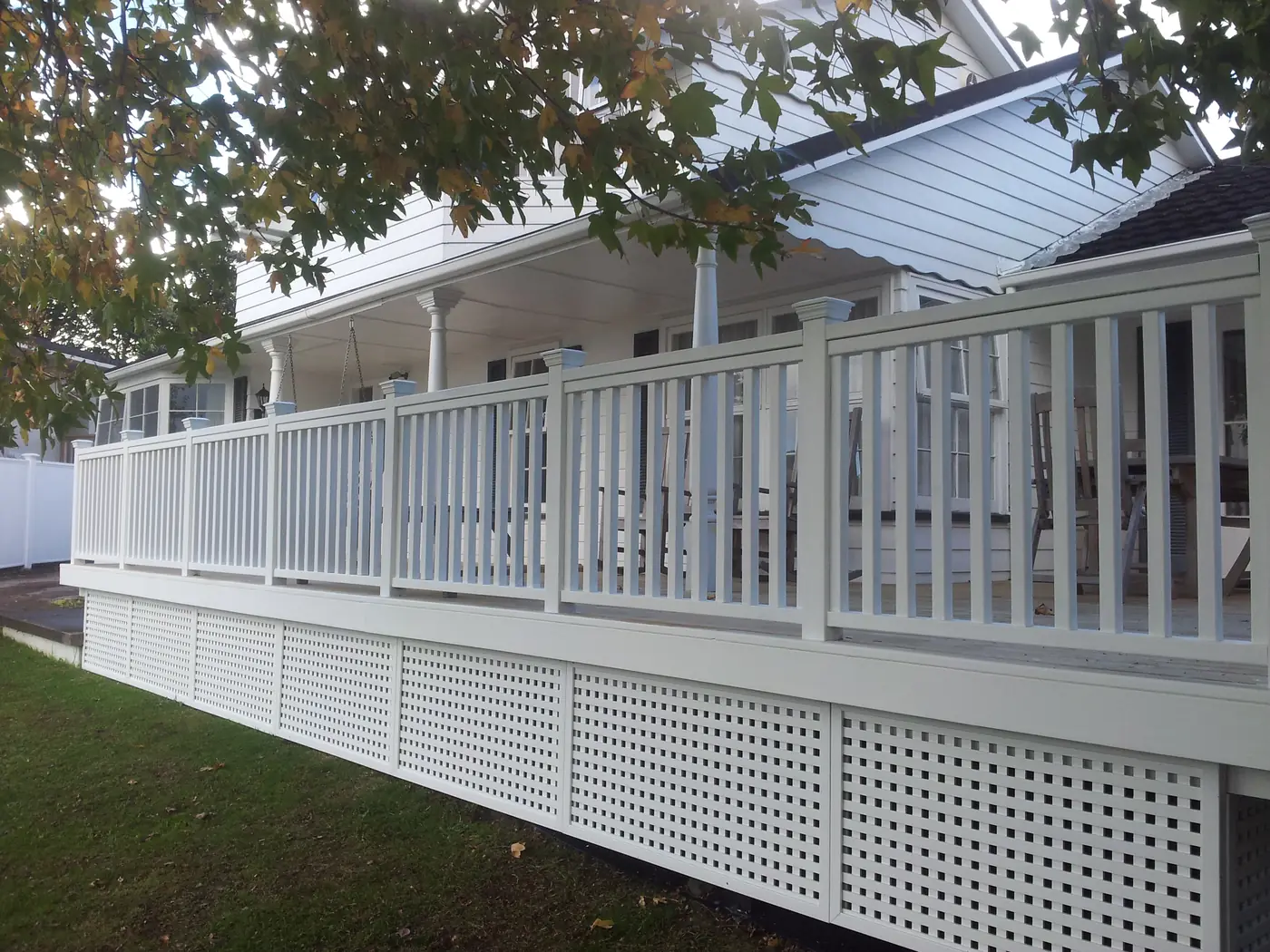 White balustrade and lattice deck by Custom Decks and Fences